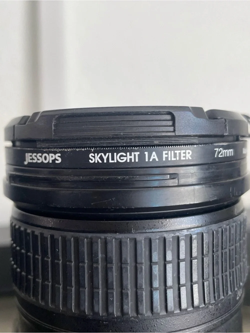 Nikon Black DSLR with Telephoto Zoom and Lens Hood